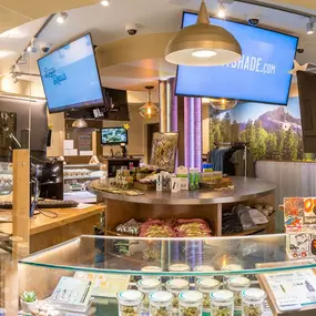 Inside the dispensary showcasing cannabis products, accessories, and digital displays.