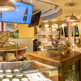 Dispensary interior featuring cannabis accessories, edibles, and branded Lightshade products.