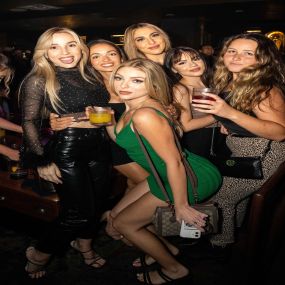 Group of woman pose for the camera at Oxford Social Club, San Diegos Premier Nightlife experience