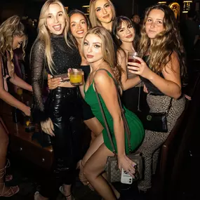 Group of woman pose for the camera at Oxford Social Club, San Diegos Premier Nightlife experience