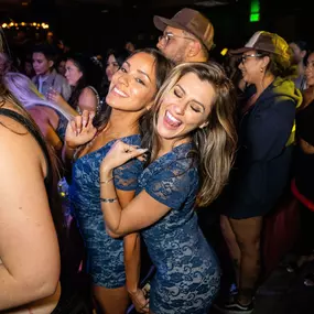 two bottle service girls take a photo as they have fun at Oxford Social club, San Diegos best nightlife experience