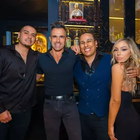 Bartenders in action at a bustling San Diego nightlife spot