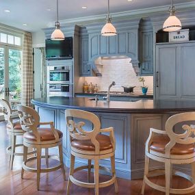 Blue Kitchen Cabinetry with Bar Chairs at Island