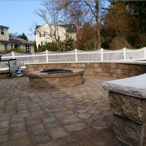 Backyard Paving Stones with Retaining Wall and Firepit