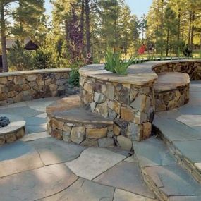 Retaining wall with wall stones, decking and fire pit