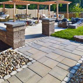 Complete backyard with polished paver stone decking and walkways