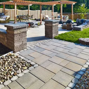 Complete backyard with polished paver stone decking and walkways