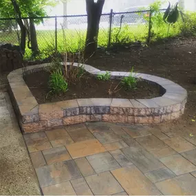 Heart shaped landscape area along with Cambridge paver stones