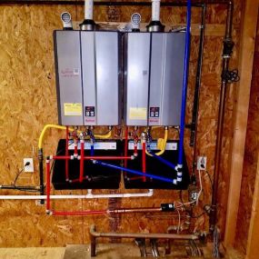 A image of a tankless water heater installed by our tyler plumbers.