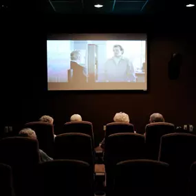 Residents enjoying a movie night at Saint Therese of Oxbow Lake!