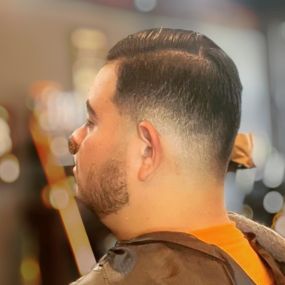 Low skin fade side part haircut.