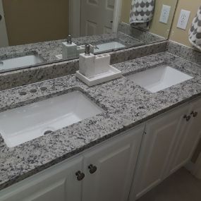 Are you looking to have a double vanity like this one installed in your bathroom? Let us help!