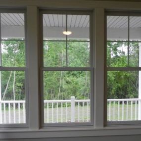 three double hung windows fill a space