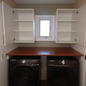 New custom laundry area with countertop and cabinets in Millheim, PA