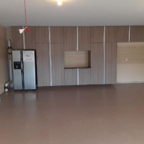Custom garage floor, cabinets, and slat wall in Williamsport