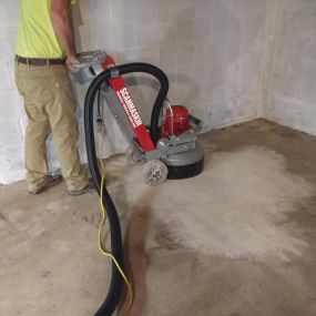 Basement Epoxy floor finish preparation using proper equipment.