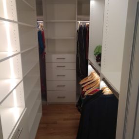 Custom walk in closet with LED closet rods and recessed LED strip lighting in State College