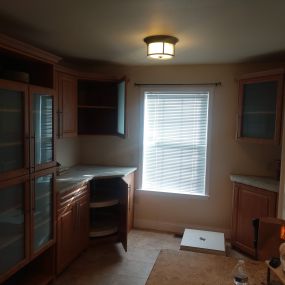 Custom kitchen cabinets in Harrisburg with crown molding to match existing kitchen