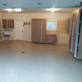 Complete Garage transformation with new epoxy floor, new custom cabinets, new slatwall
