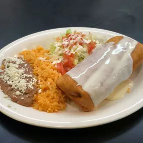 Our burritos are as tasty as they are big, and they are ENORMOUS at Nacho's Taqueria & More Authentic Mexican Food in Kennesaw, GA. Served with rice, beans, salad, and plenty of cheese as seen in this picture, it's a delight for the senses and a well-balanced meal. Order online, stop in, or request delivery to get yours today. We're open for breakfast, lunch, and dinner Monday through Saturday!