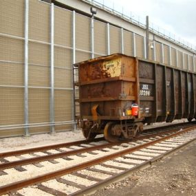 Rail road noise absorbing wall