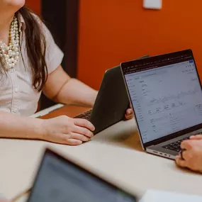 Team Members Melanie and Josh using google analytics to do conversion optimization for a client's google advertising campaign.