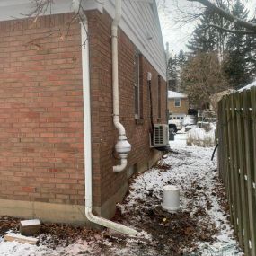 Radon system on a house in the winter