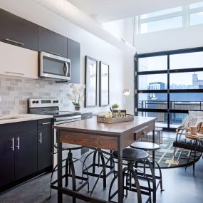 550 Ultra Lofts Island and kitchen with natural lighting