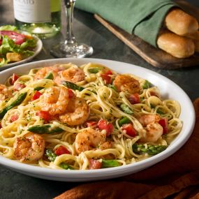 Shrimp Scampi: Lighter take on an Italian classic! Shrimp sautéed in a garlic sauce, tossed with asparagus, tomatoes and angel hair.