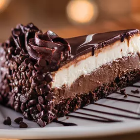 Black Tie Mousse Cake: Chocolate cake, dark chocolate cheesecake and creamy custard with icing.