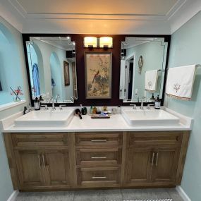 We installed a nice combination of cabinetry, painting and varied mirrors to create a newly decorated master bath