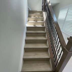 Replaced carpet on stairs with luxury vinyl tile. We improved the appearance and strength of this railing to something much prettier in the home.