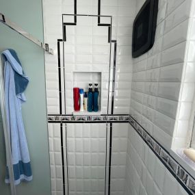 Full remodel, gutted tub to create a larger shower. Tile was used in varied styles to create a unique pattern