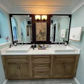 We installed a nice combination of cabinetry, painting and varied mirrors to create a newly decorated master bath