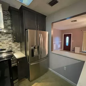 Updated vent hood and fresh new backsplash updated this kitchen via a full remodel