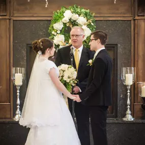 Vows in front of the Ivy House fireplace.