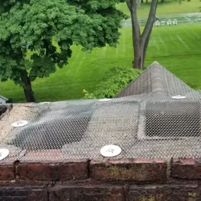 Custom made stainless steel chimney cap to keep the racoons away. This custom made chimney cap will not only prevent animal entry for years to come but will also keep debris and rain/snow from causing any further damage inside the chimney.