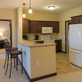 The kitchen is complete with a refrigerator, self-cleaning oven, microwave, dishwasher, disposal and pantry in each apartment at The Redwoods Senior Apartments