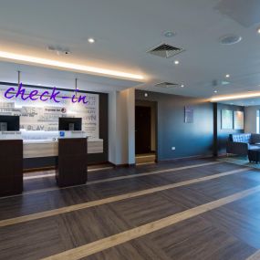 Premier Inn reception with check in desk and kiosks