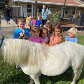 Preschool students getting a visit from farm friends