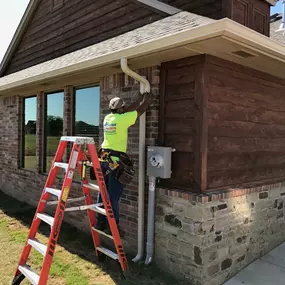 Patriot crew installing gutters