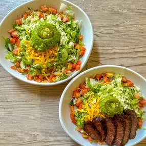 Shell or bowl? 
Our tostadas got an upgrade! Stick with the crispy fried tortilla shell or go gluten-free with a rice-based bowl. Either way, you’re in for a treat with black beans, crisp lettuce, and juicy tomatoes. Which one’s calling your name?