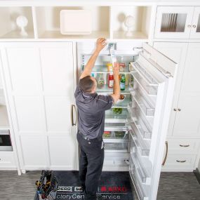 A technician changes out the Factory Certified filters on a Sub-Zero refrigerator.