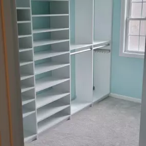 Practical storage with room to spare. This custom closet features adjustable shelving and hanging rods to optimize every inch for neatly organizing your belongings. The clean, light design creates an open, refreshing space that brings order amid life's clutter.