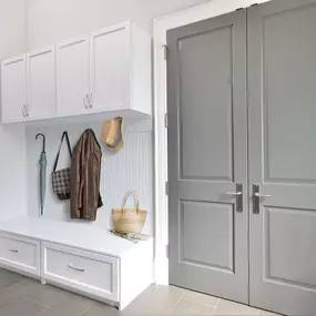 Keep all your outdoor gear tucked behind closed doors with this Entryway Storage Solution. The bench seat provides seating for putting on and taking off shoes, encouraging your guests to get comfortable, and protecting your house from dirt. #TailoredLiving #FreeConsultation #EntrywayOrganization #Ta