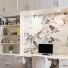 We are here for your WFM office inspiration! We love the modern white and silver cabinet combination paired with the beautiful floral accents. Want your dream office? Call us today!