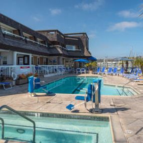 Outdoor pool and hot tub at The Bay Club Hotel & Marina