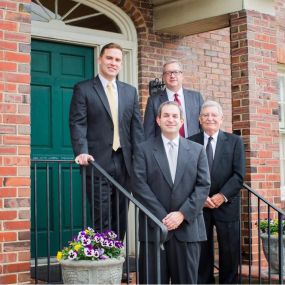 Attorneys of McKinney, Tucker & Lemmel, LLC from left to right: David W. Martin, Gary C. Lemel (front), James W. Tucker, Jr., and Thomas A. McKinney