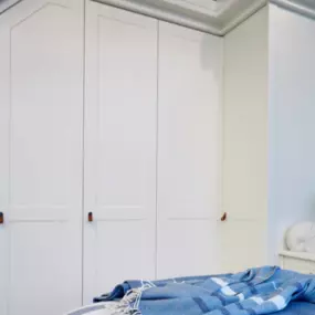 White Shaker Wardrobes on a sloped ceiling