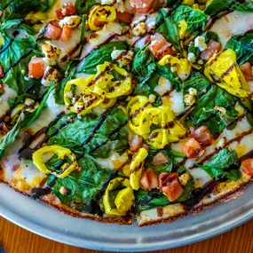 Creamy Marinara Sauce, Spinach, Tomatoes, Feta, Banana Peppers & Drizzled Balsamic Glaze.